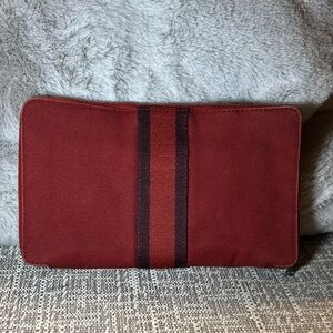 178. Hermès Fourre-Tout GM travel wallet in a red canvas with COA